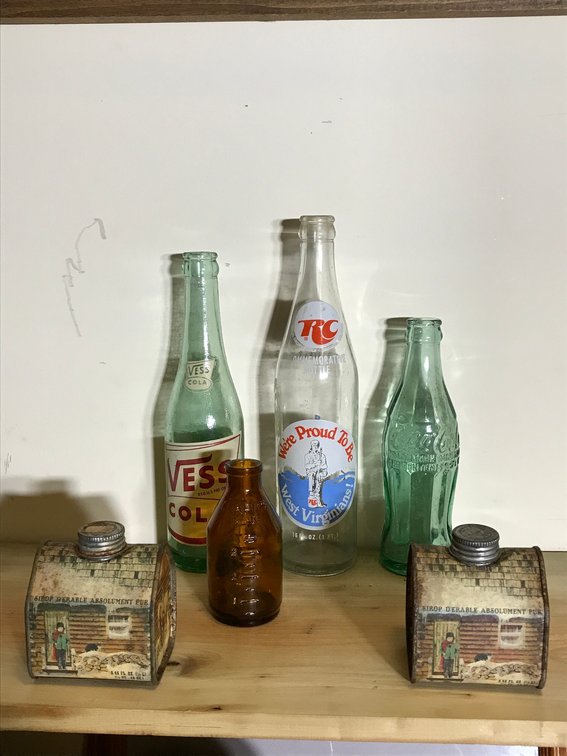 Vintage soda bottles, syrup, tins, misc.