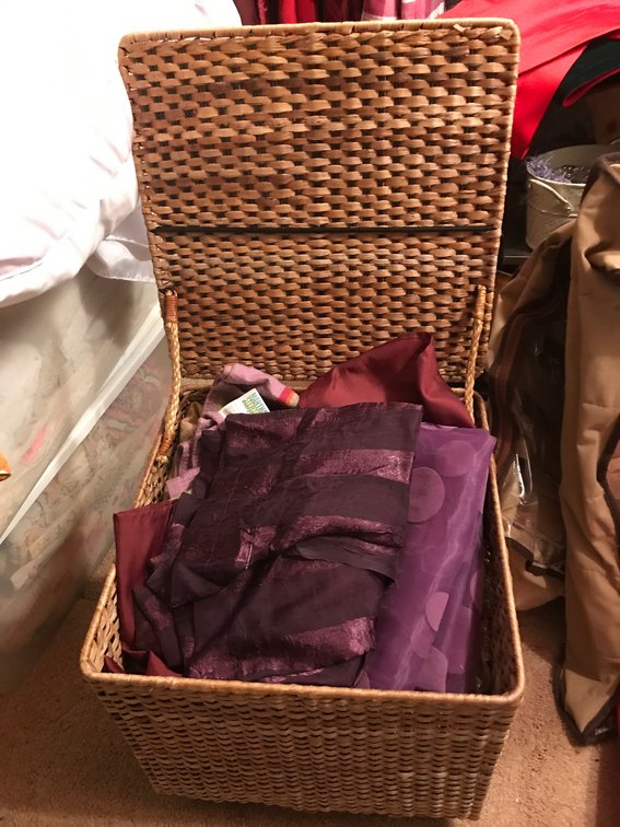 Wicker basket with linens