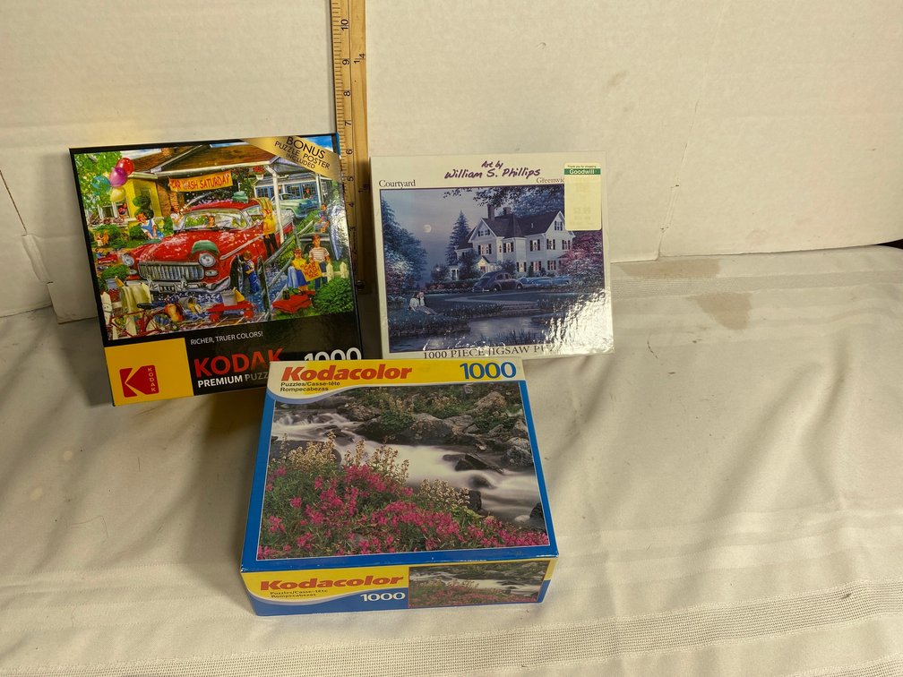 THREE 1,000-PIECE PUZZLES