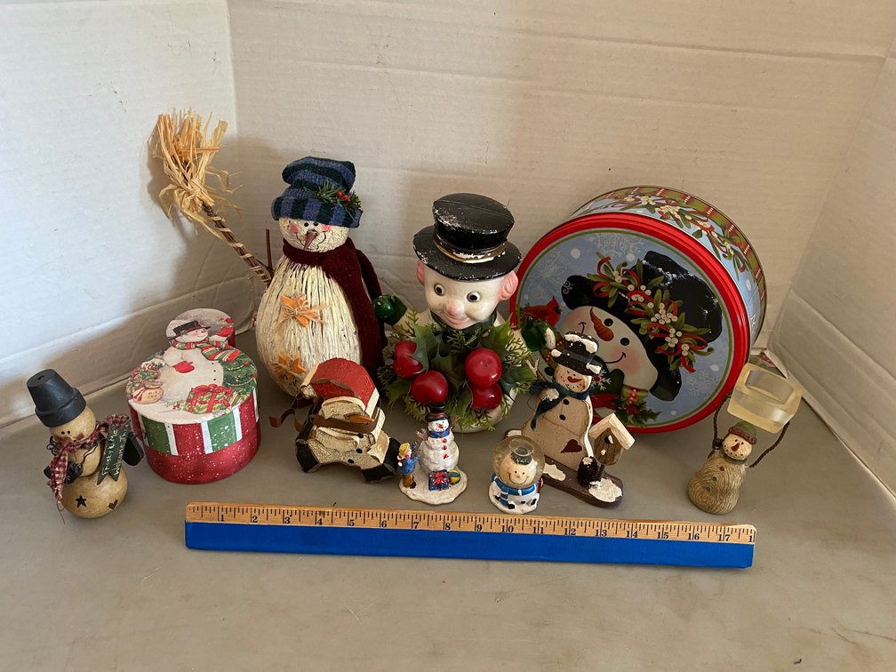 HOLIDAY DECORATIONS: A SNOWMAN TIN