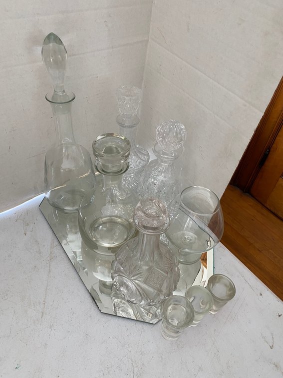 FIVE GLASS DECANTERS WITH STOPPERS