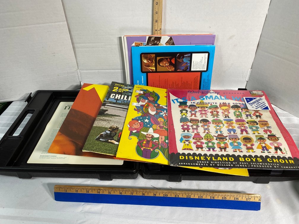 COLLECTION OF FOUR CHILDREN'S RECORDS IN A PLASTIC SILVER BURDETT MUSIC SHOWCASE