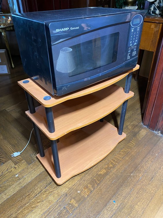 SMALL THREE SHELF STAND AND A BLACK SHARP CAROUSEL STYLE MICROWAVE