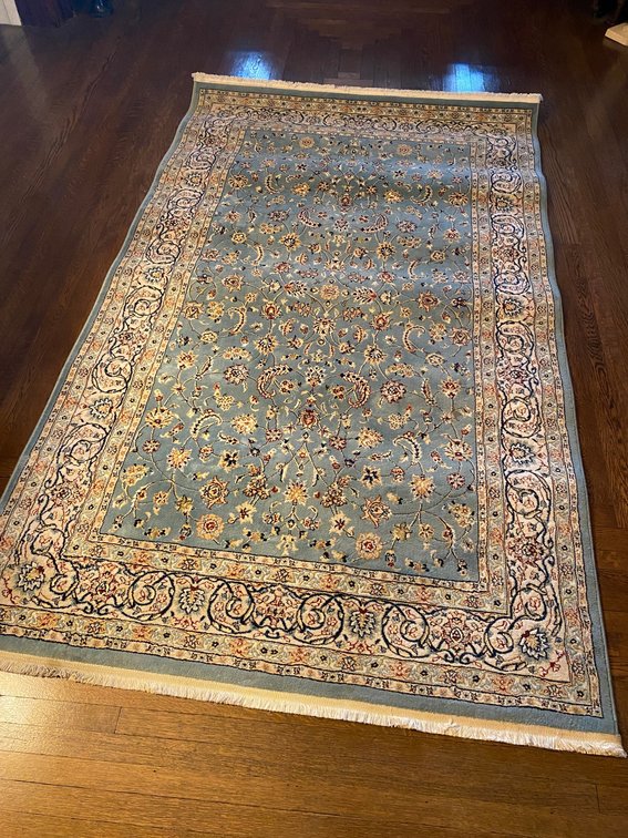 APPROXIMATELY FIVE BY EIGHT FOOT FLOOR RUG