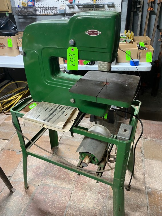 CRAFTSMAN BANDSAW MOUNTED ON A METAL STAND