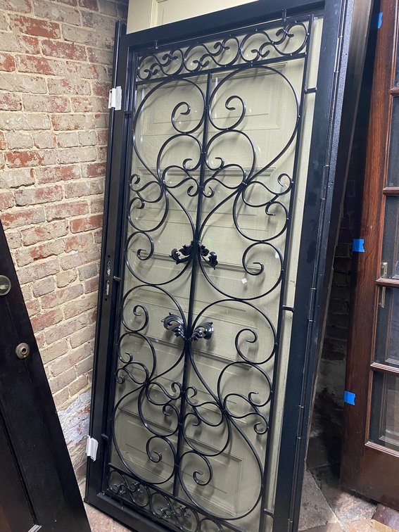 SCREEN DOOR WITH METAL WROUGHT IRON DECORATIVE FRAME