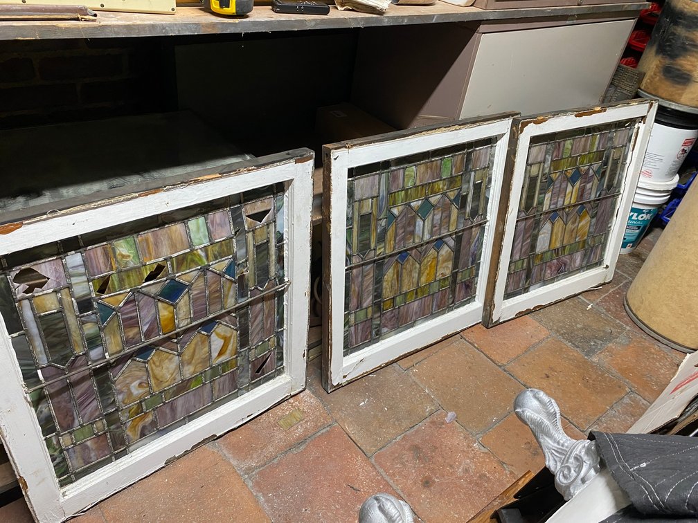 THERE ARE THREE FRAMED ANTIQUE STAINED GLASS WINDOWS