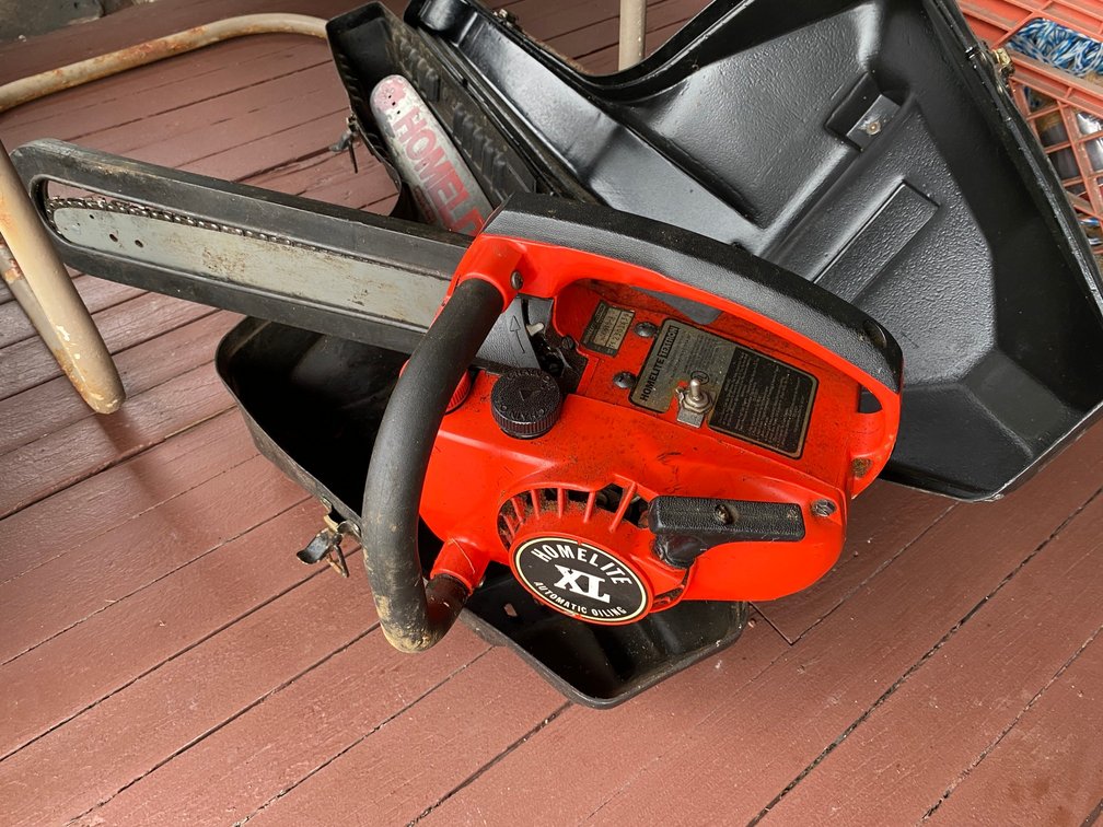 HOMELITE XL CHAINSAW WITH A STORAGE CARRYING CASE
