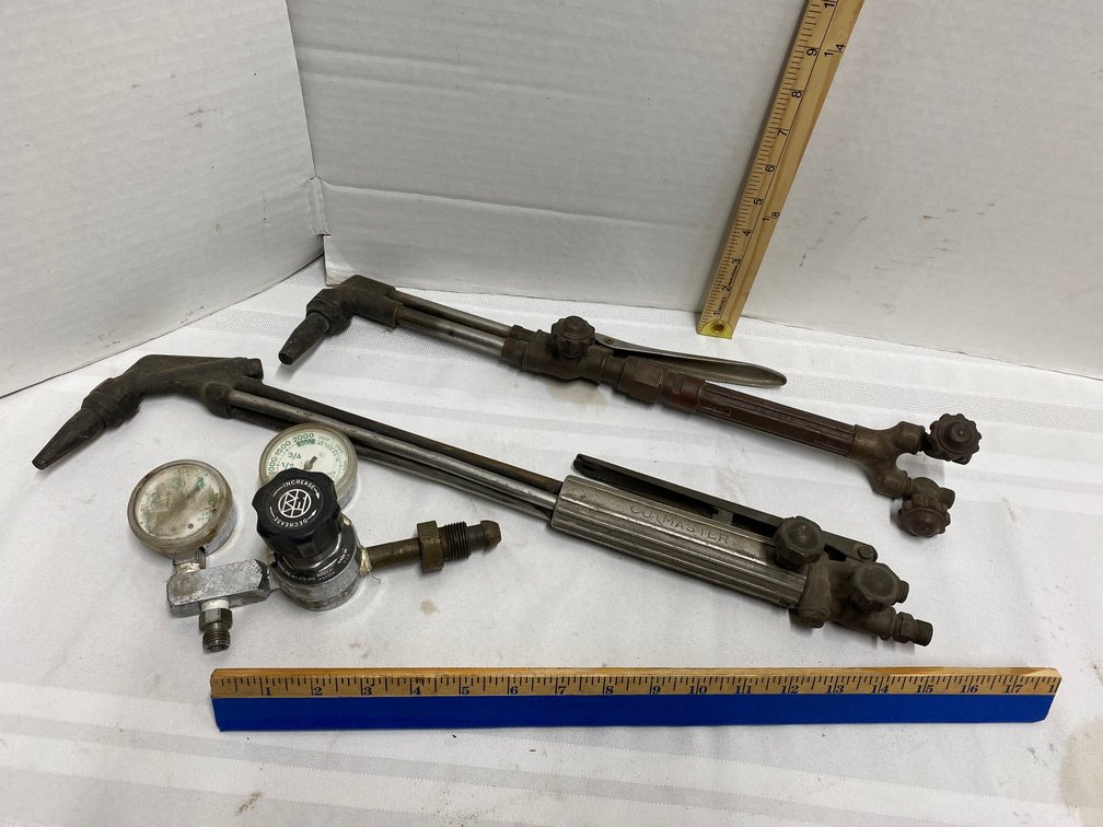 TWO TORCH HEADS AND A SET OF GAGES