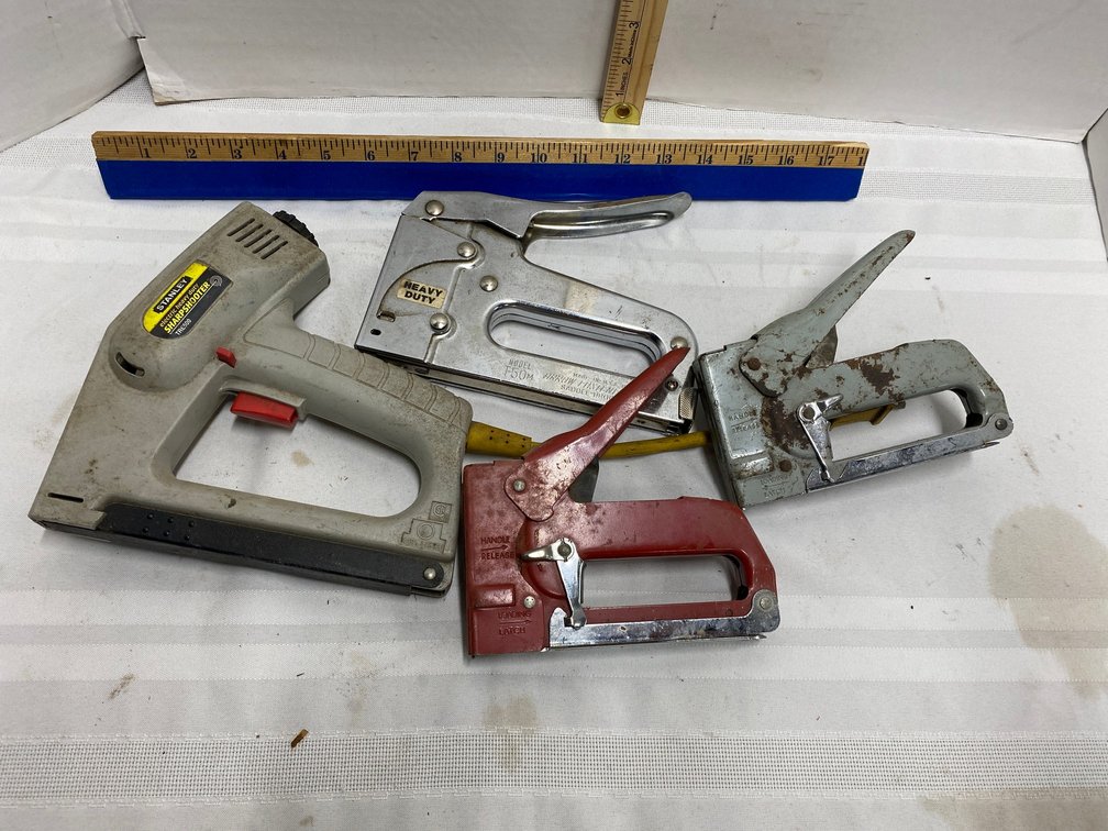 FOUR STAPLE GUNS