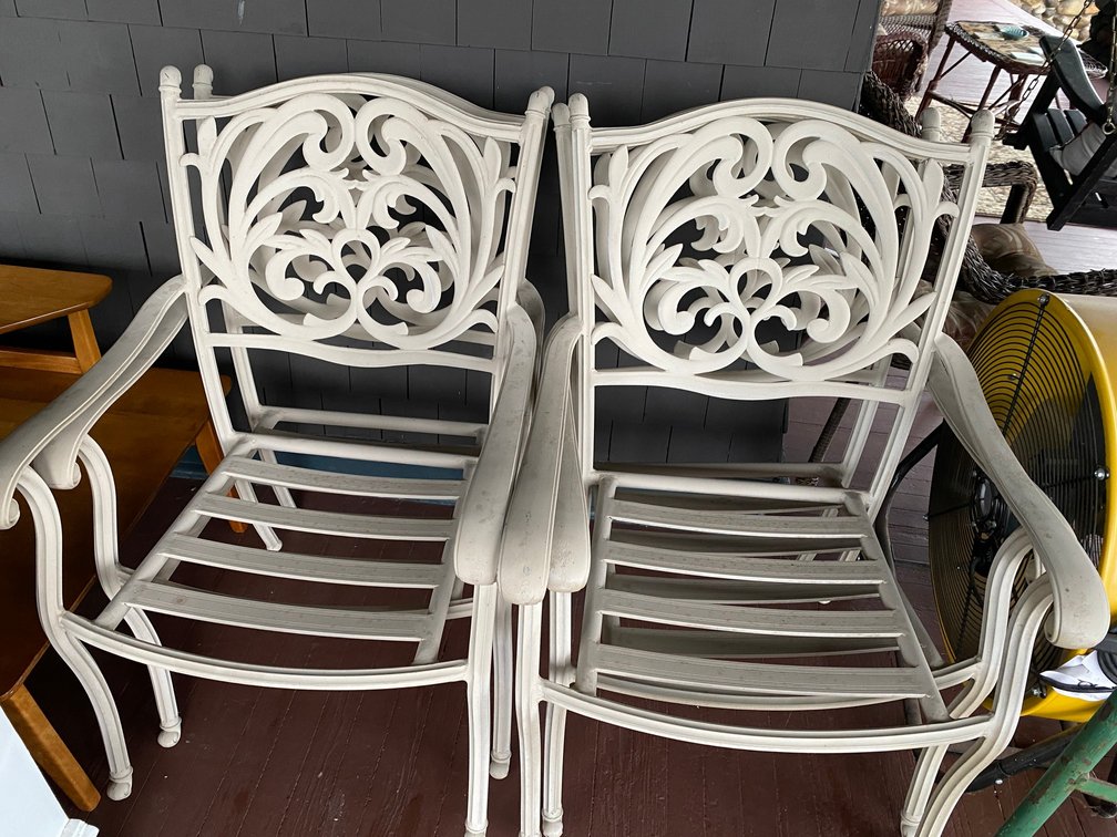 FOUR METAL STACKING PATIO CHAIRS