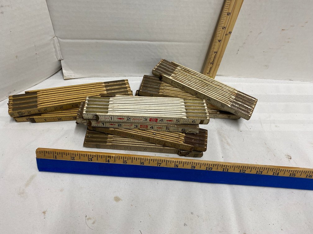 NINE FOLDING CARPENTERS MEASURING STEEL