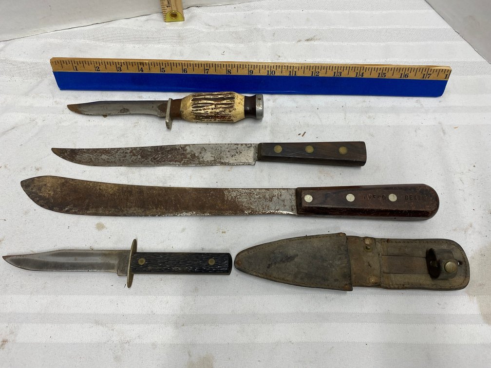 THREE KNIVES AND A CORN CUTTER