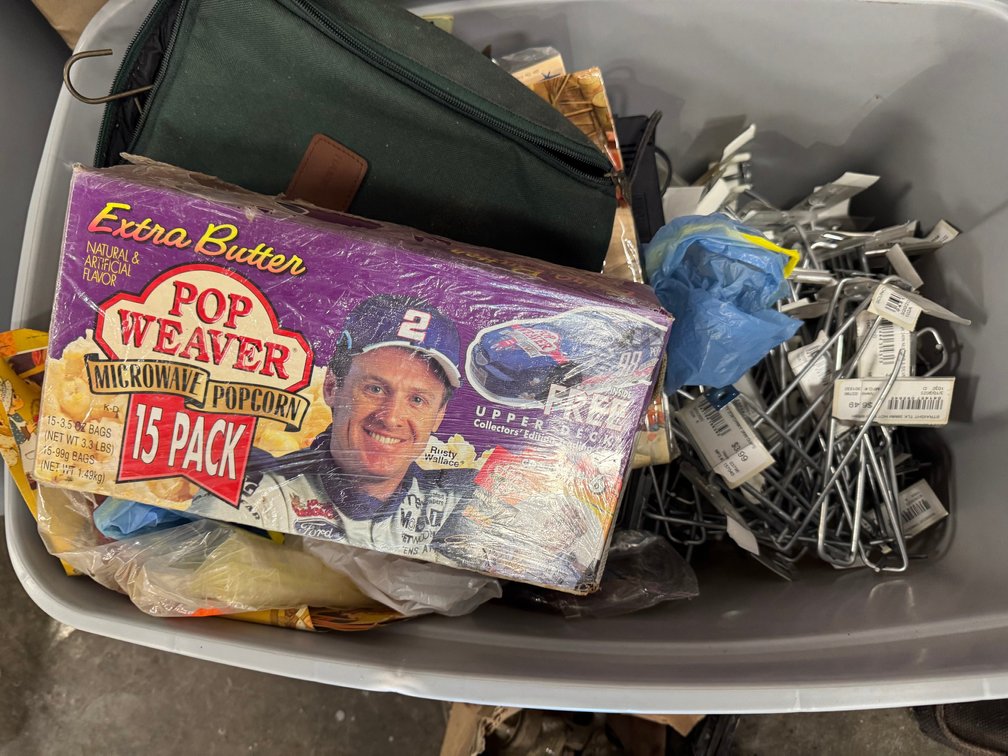 Storage bin with bag and assorted contents