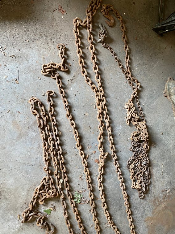 Assortment of tow chains-1 has hooks on both ends-others have 1 hook-various sizes