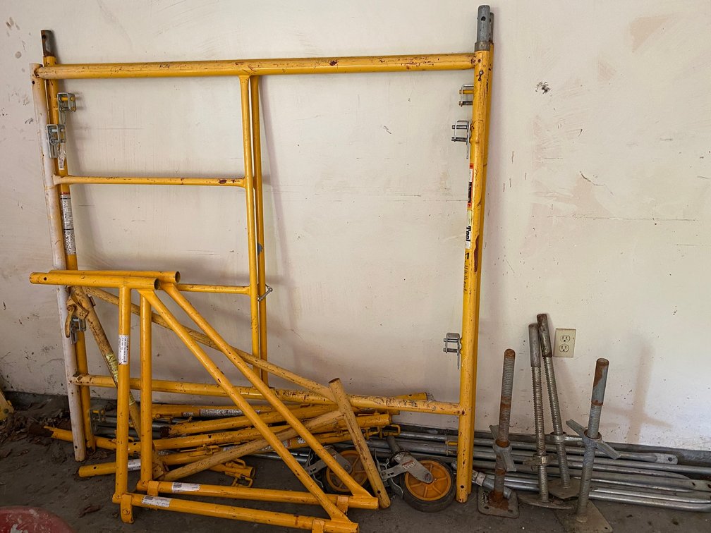 Set of metal scaffolding-5' wide-comes with 4 levelers, 2 wheels, railing, supports, extra braces