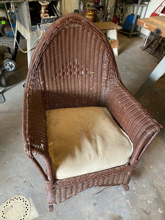 Wicker rocking chair with cushion**does have some broken wicker pieces**