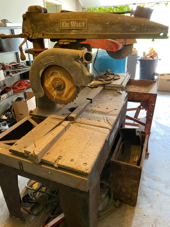 Large DeWalt radial arm saw, 230 volt, with extension cord and accessories