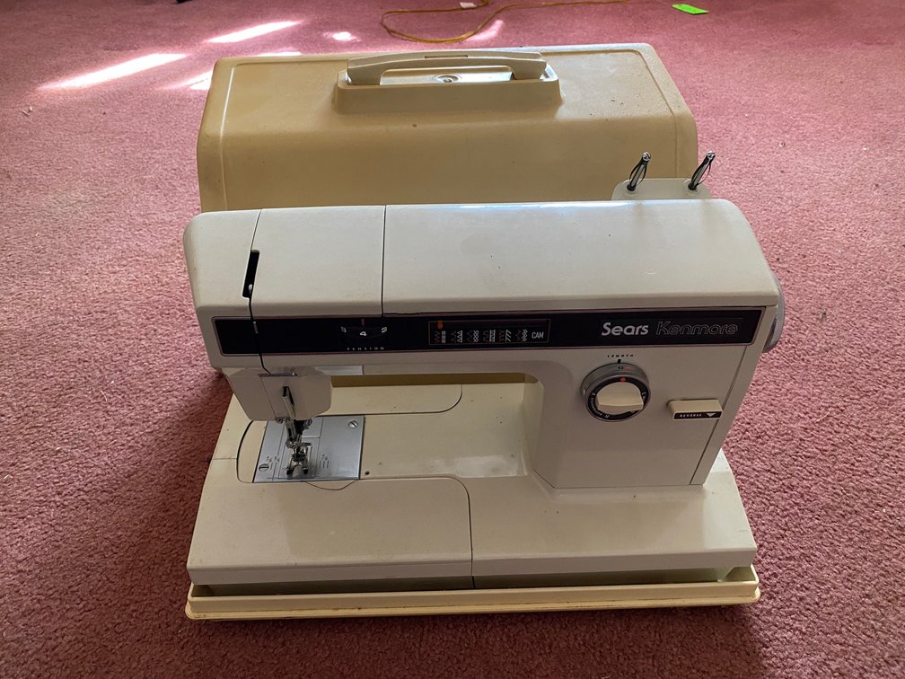 Sears Kenmore sewing machine with cover