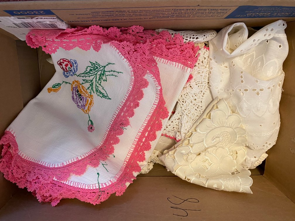 Assortment of doilies and fancy work