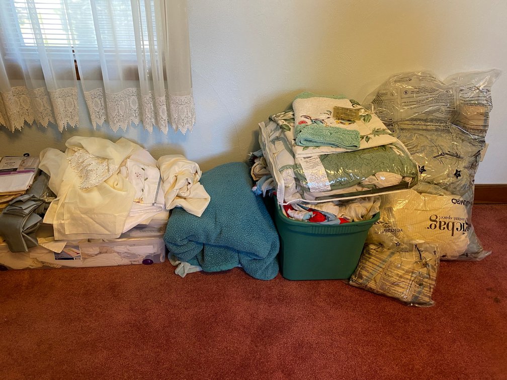Large lot of linens, bedspreads, curtains, blankets