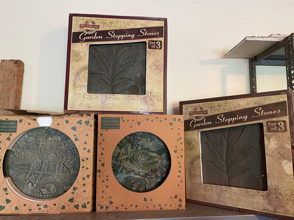 4 Boxes of hand painted garden stepping stones