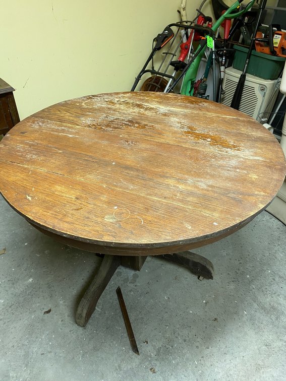 Round wooden pedestal base table**does have staining**