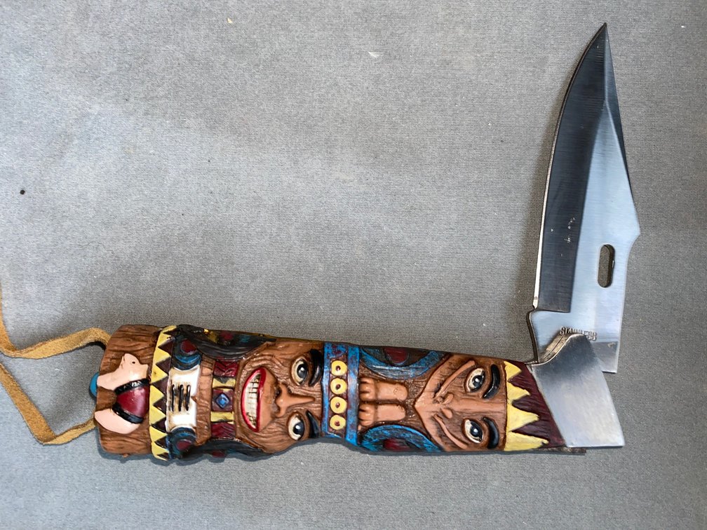 Folding knife in native american theme