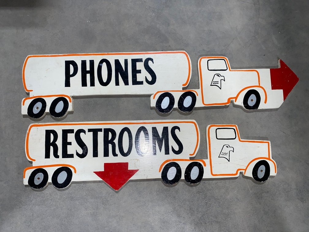 Wooden Phones and Restrooms Sign