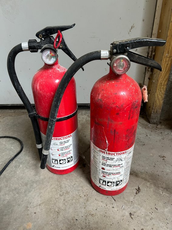 2 Fire extinguishers-1 green, 1 red