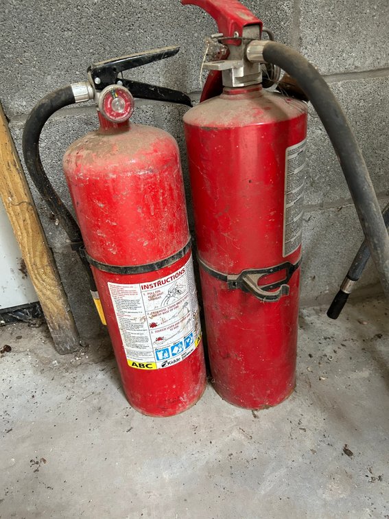 2 Fire extinguishers-both green