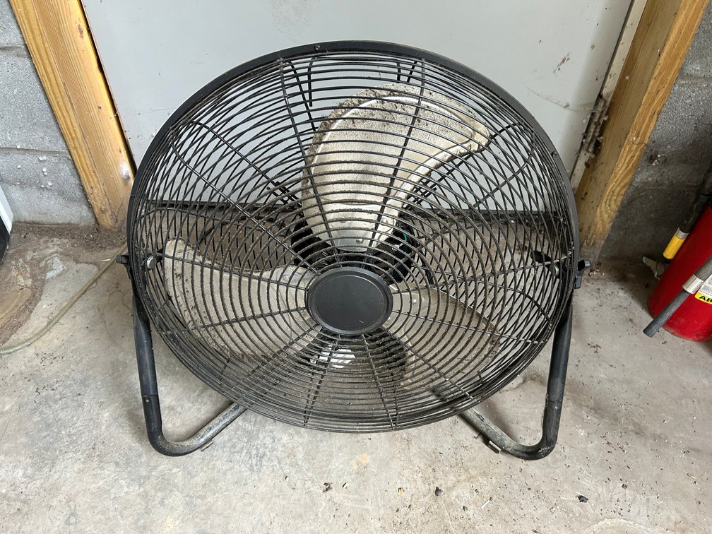 Wire encased tabletop fan
