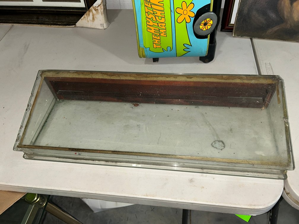 Glass showcase with back door opening