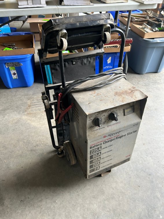 Schumacher battery charger/engine starter-12 volt, mechanic's dolly