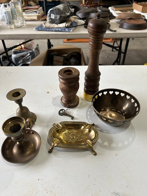 Wooden grinder shaker, brass candlesticks, other decorative items