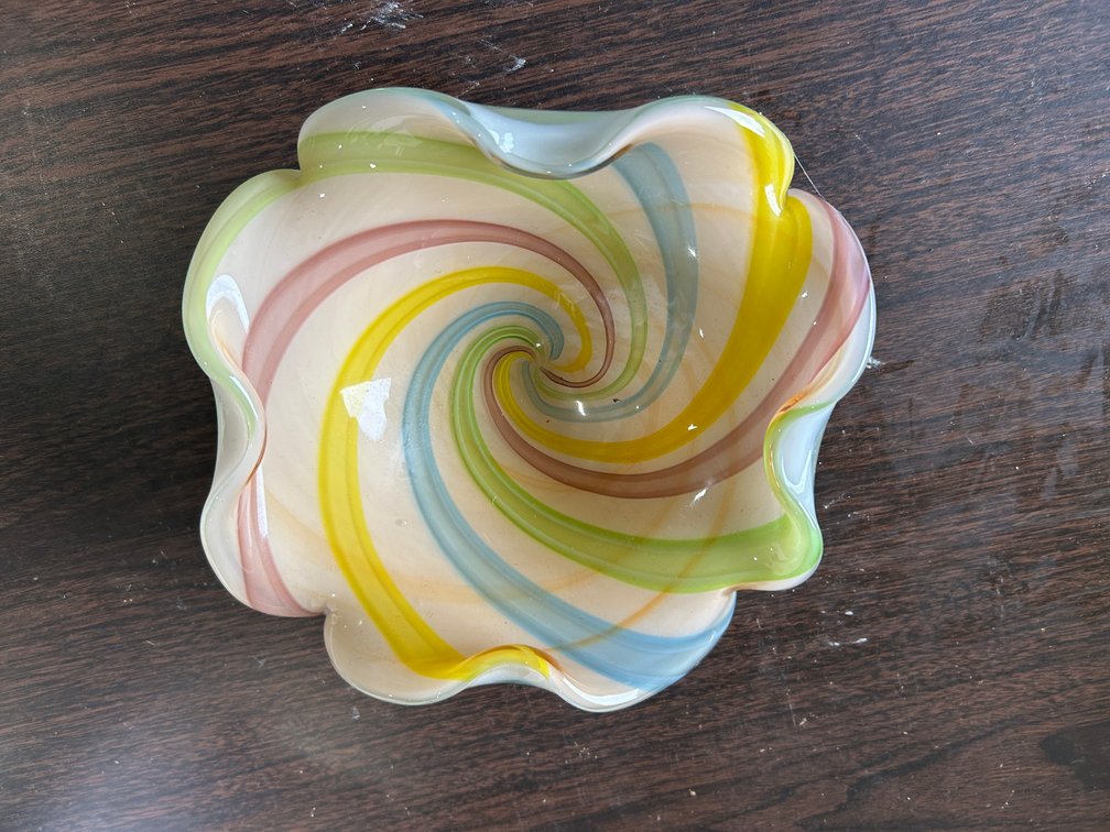 Ruffled edge Artisan glass bowl with swirls of pink, yellow, blue and green