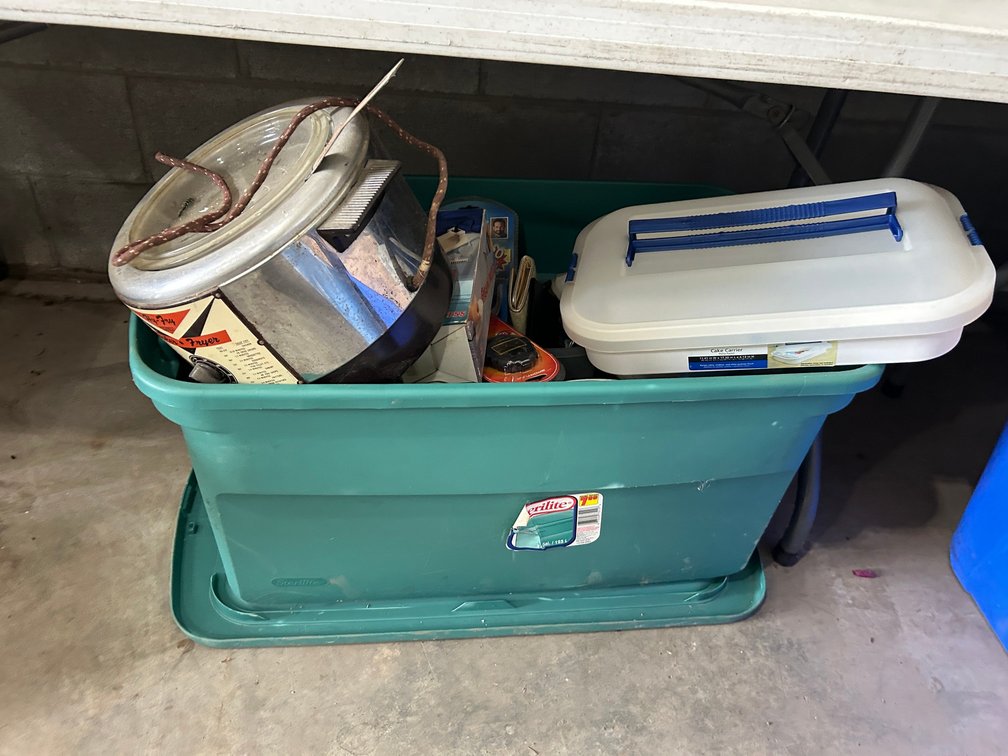 Tub with selection of kitchen items