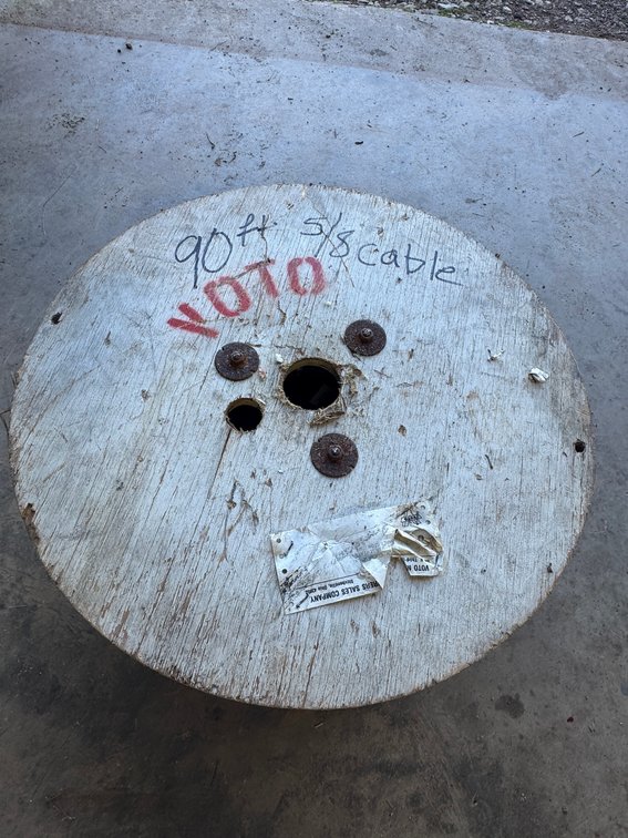 Wooden Spool with Hand Written Red Tags