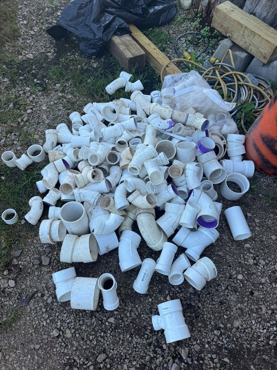 Large Pile of Assorted White PVC Pipe Fittings