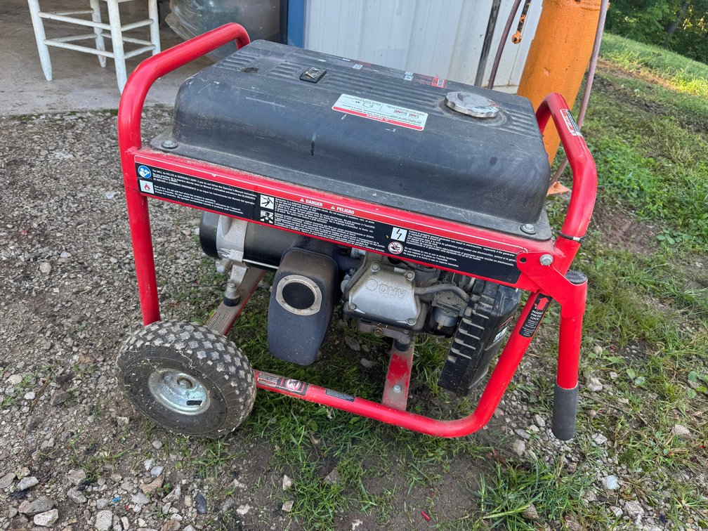 Portable Gasoline Generator with Red Metal Roll Cage, Black Fuel tank