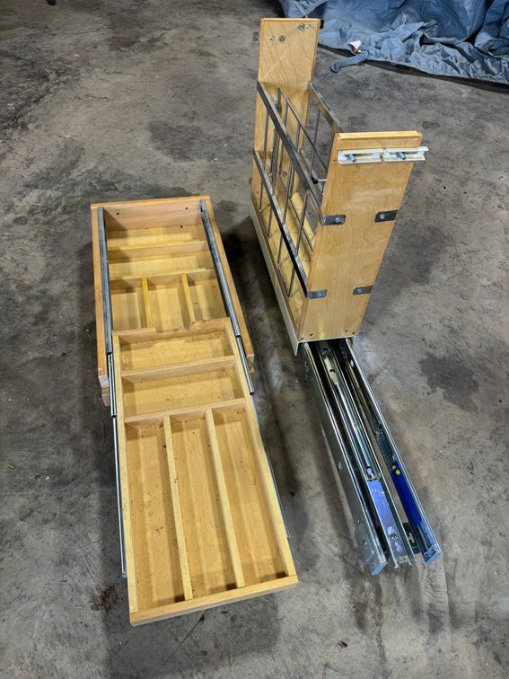 Assembly for sliding drawers and cabinet
