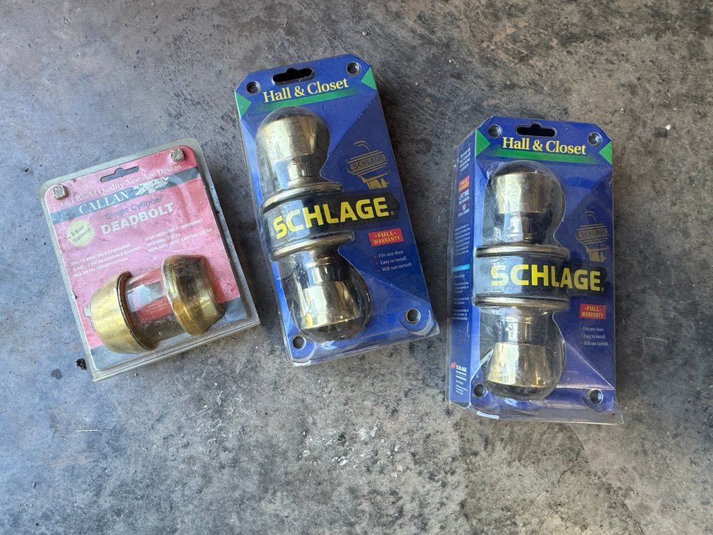 Shows Sladge Hall and Closet Passage Door Knobs, 1-Brass Dead bolt Set