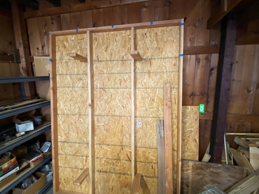6'x8' Wooden platform and scrap wood in corner