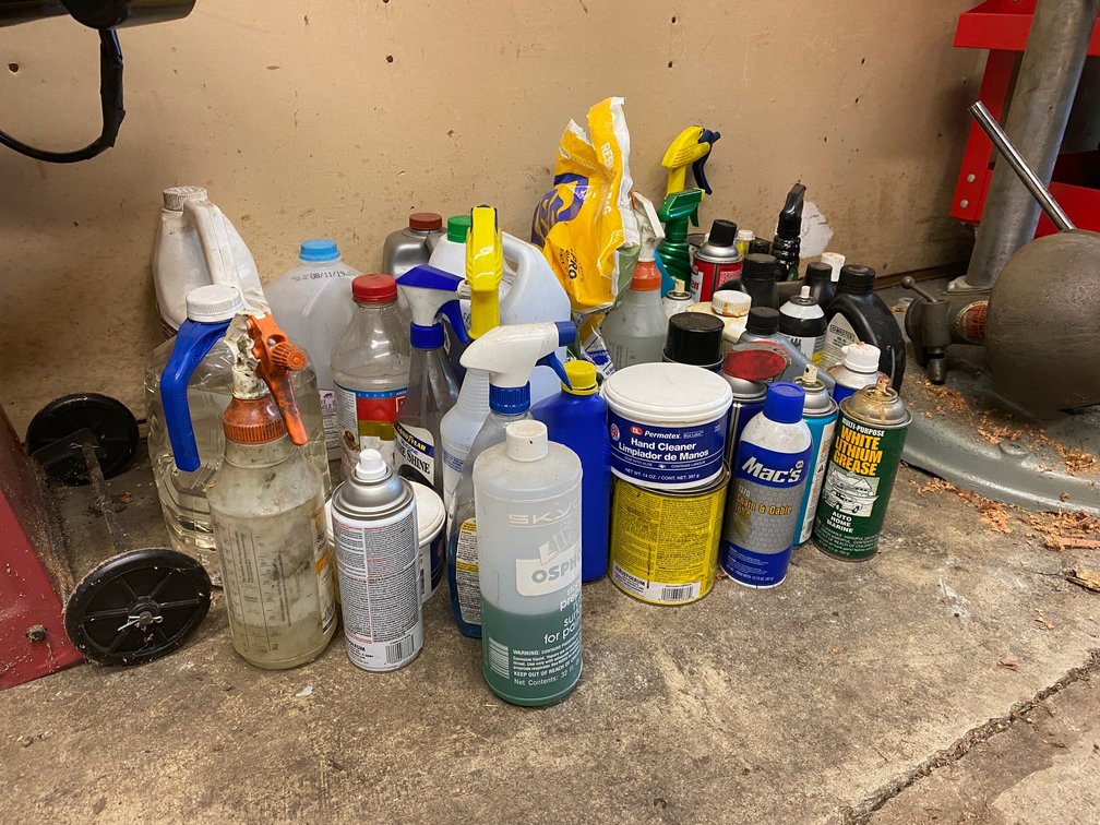 Lot of misc. lubricants, oils, cleaning supplies, automotive liquids