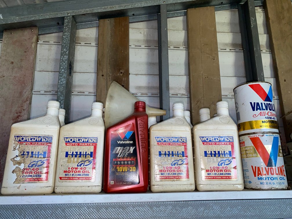Motor Oil Bottles, Cans, and Funnel