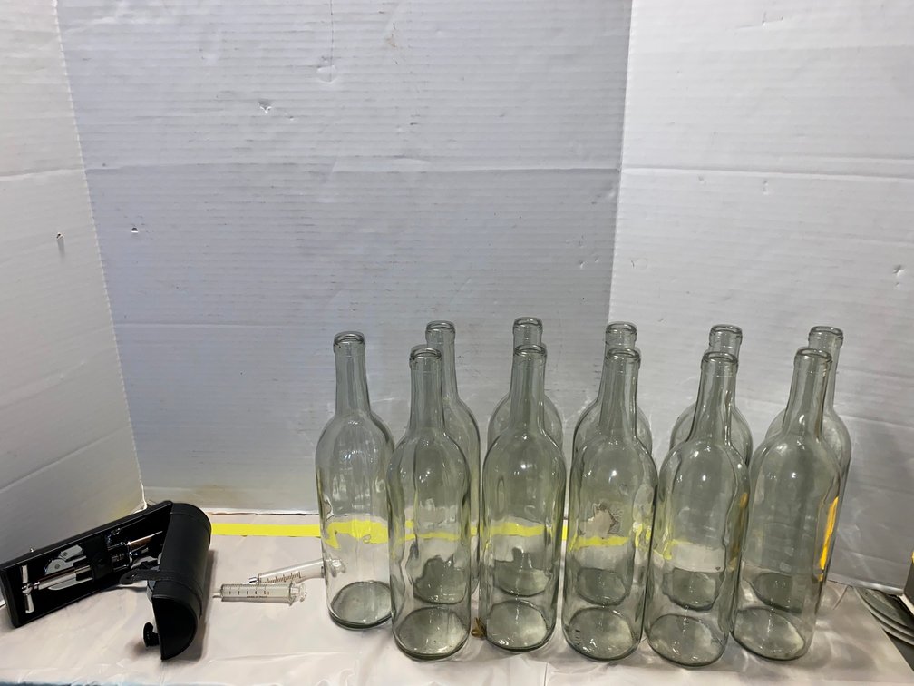 11 Glass Wine Bottles, Lever Corkscrew, and Syringes