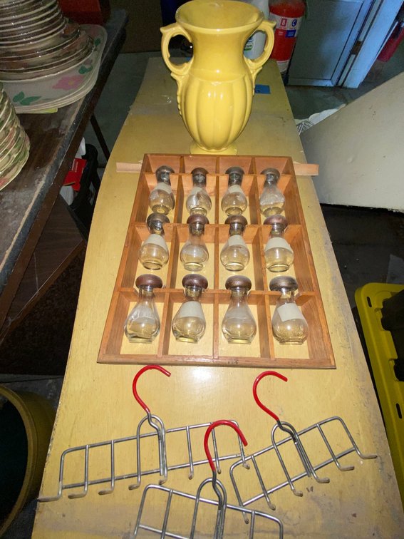 Yellow Ceramic Urn Vase, Wooden Rack with Glass Bottles, Wire Racks