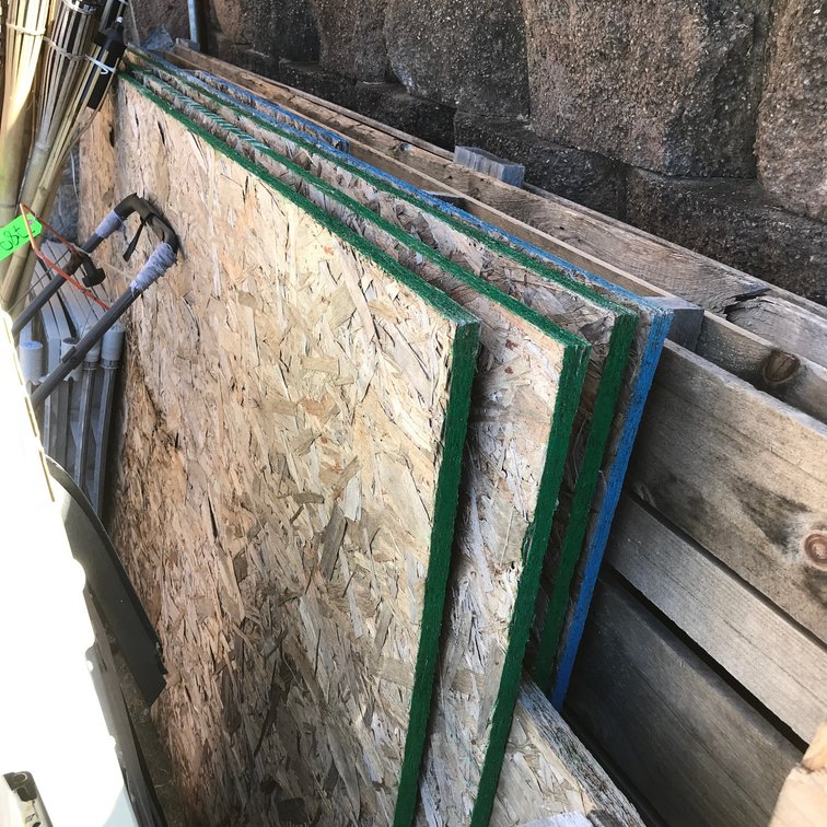 4 Full sheets of 3/4" OSB board, another partial piece, two 12' pallets, other pallets