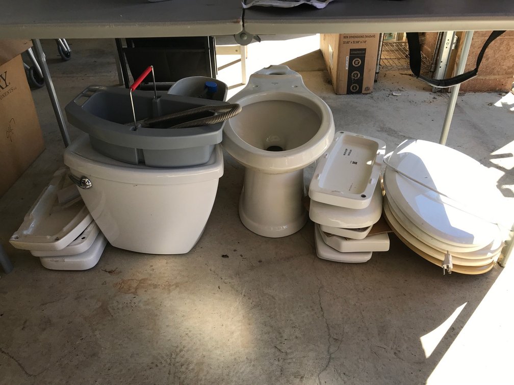 One complete toilet with bowl and tank, 8 tank lids, 3 seats