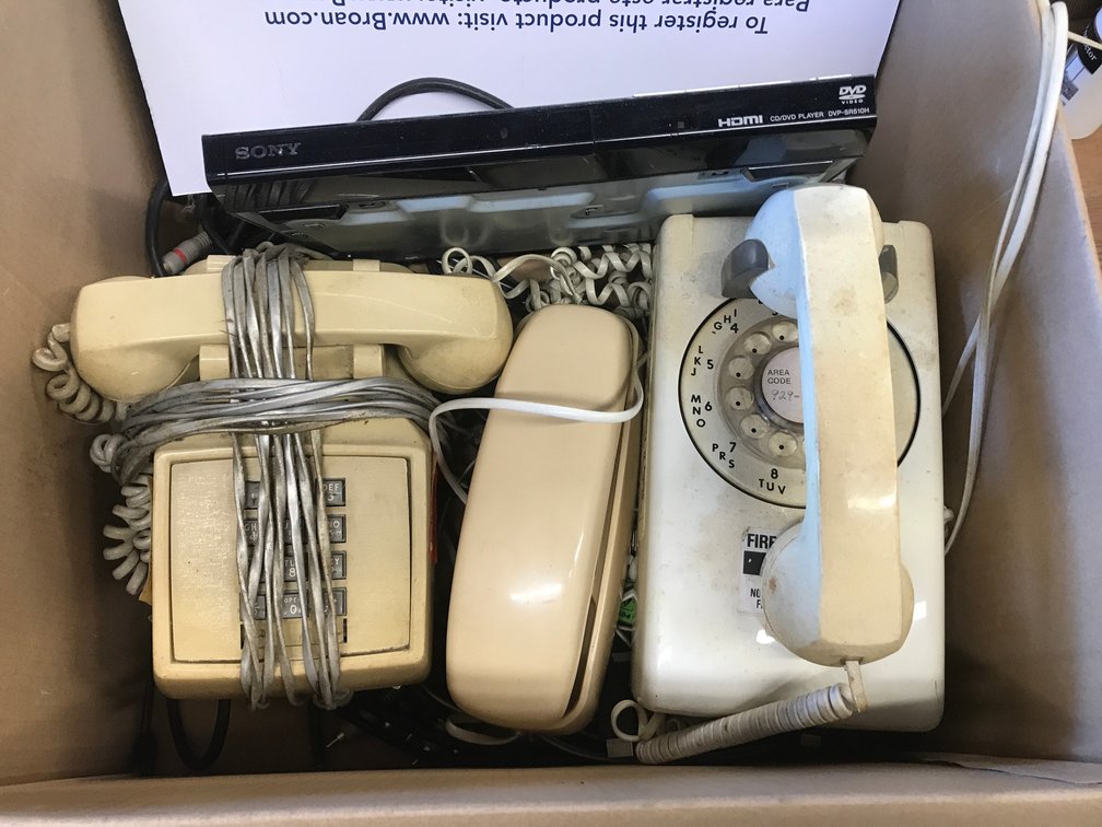 Collection of vintage phones, DVD player